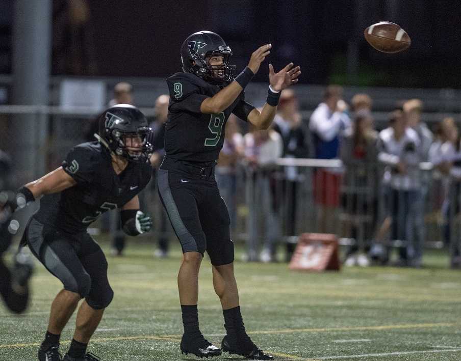 Hunter Gilbert (3) and Drew Carter (9) lead Tigard into Friday's game against No. 1 Lake Oswego. (Photo by Ralph Greene)