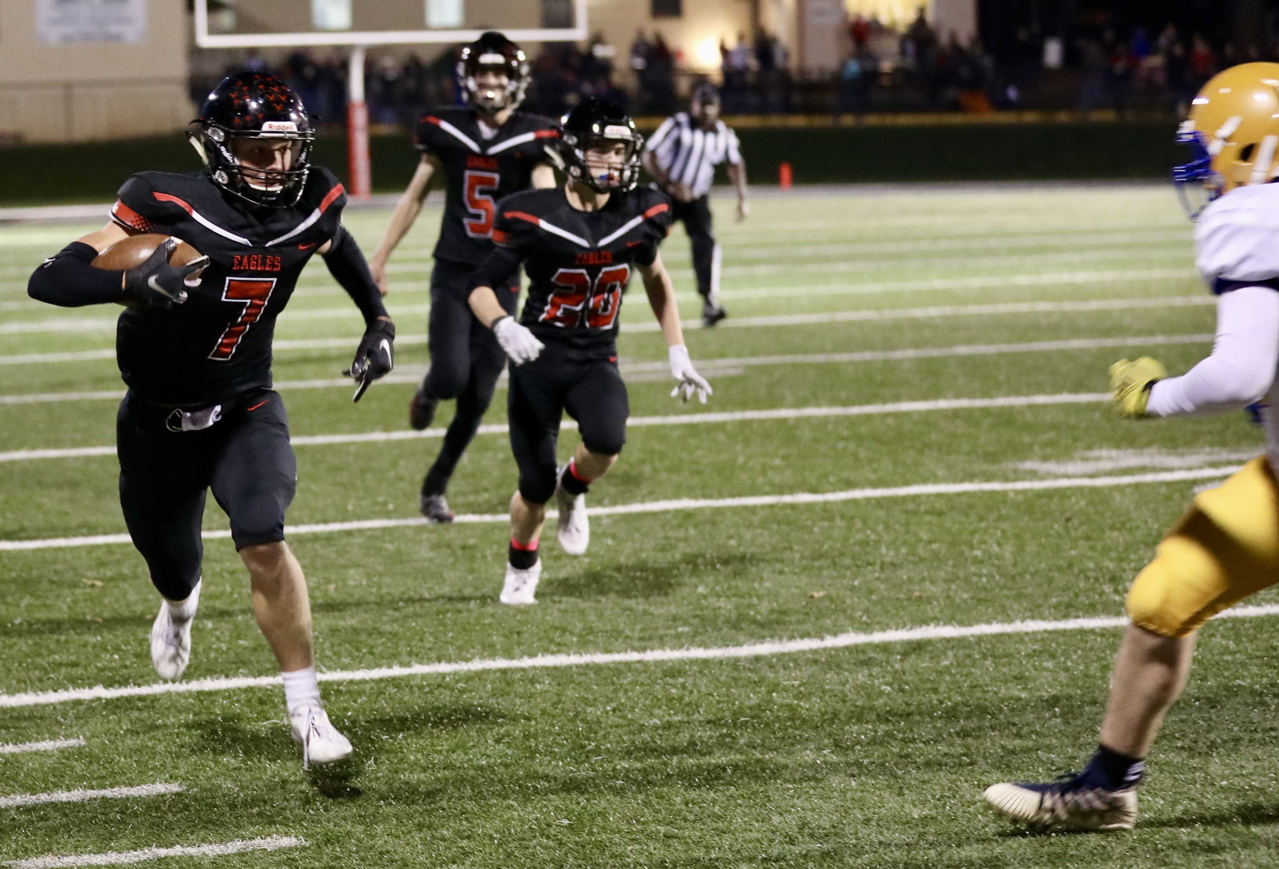 Santiam Christian linebacker Luke Mehlschau flees down the sideline after intercepting a Siuslaw pass in the opening quarter.