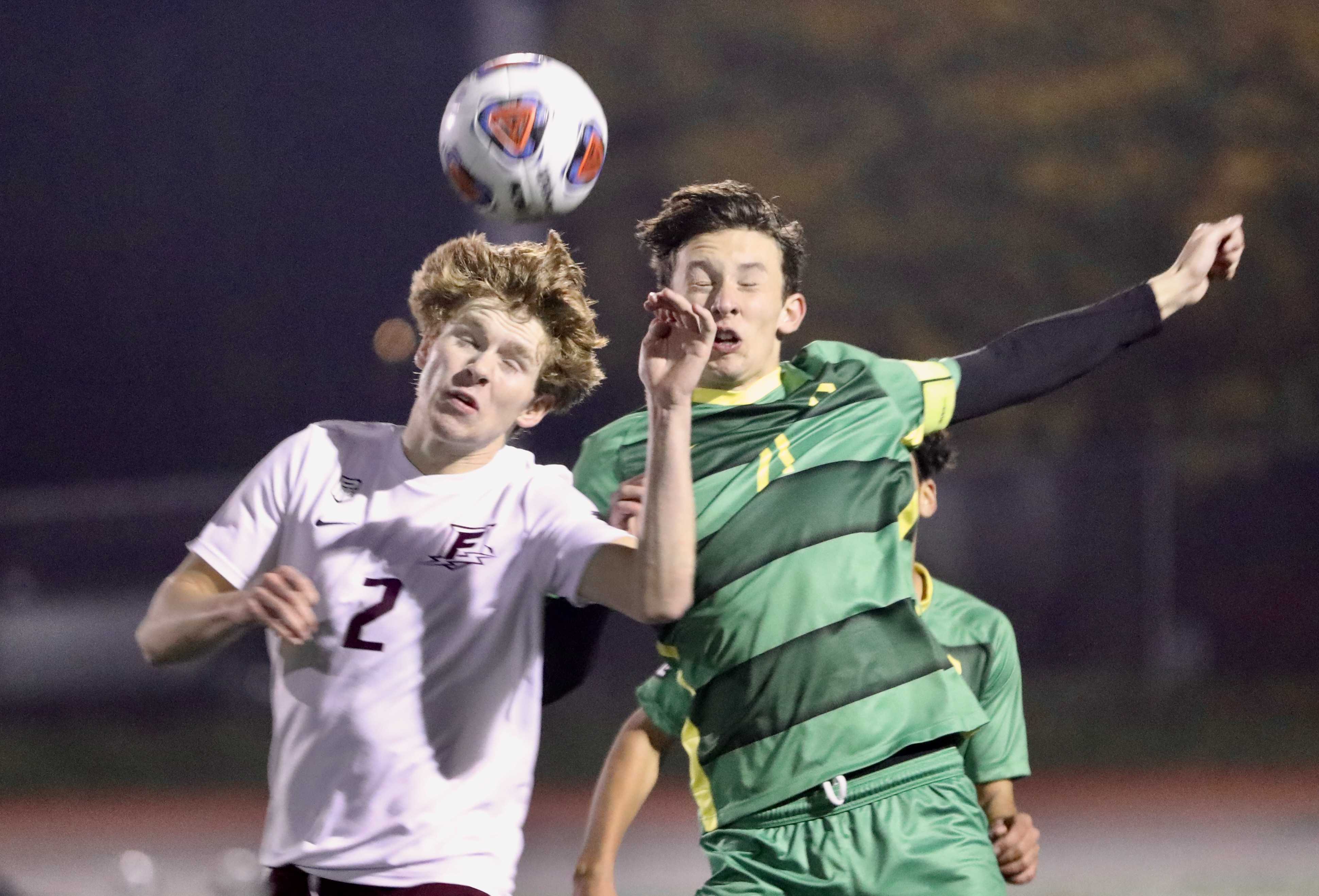 Kai Fontenot of Franklin (2) and Cleveland forward Joey Vollert contest an air ball in their state semifinal. (Norm Maves Jr)