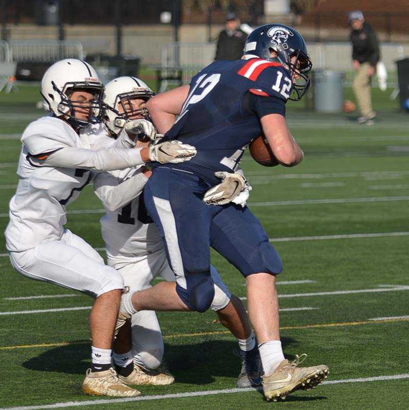 Brady Traeger bulls his way into the end zone for Kennedy's go-ahead score. Photo by Andre Panse