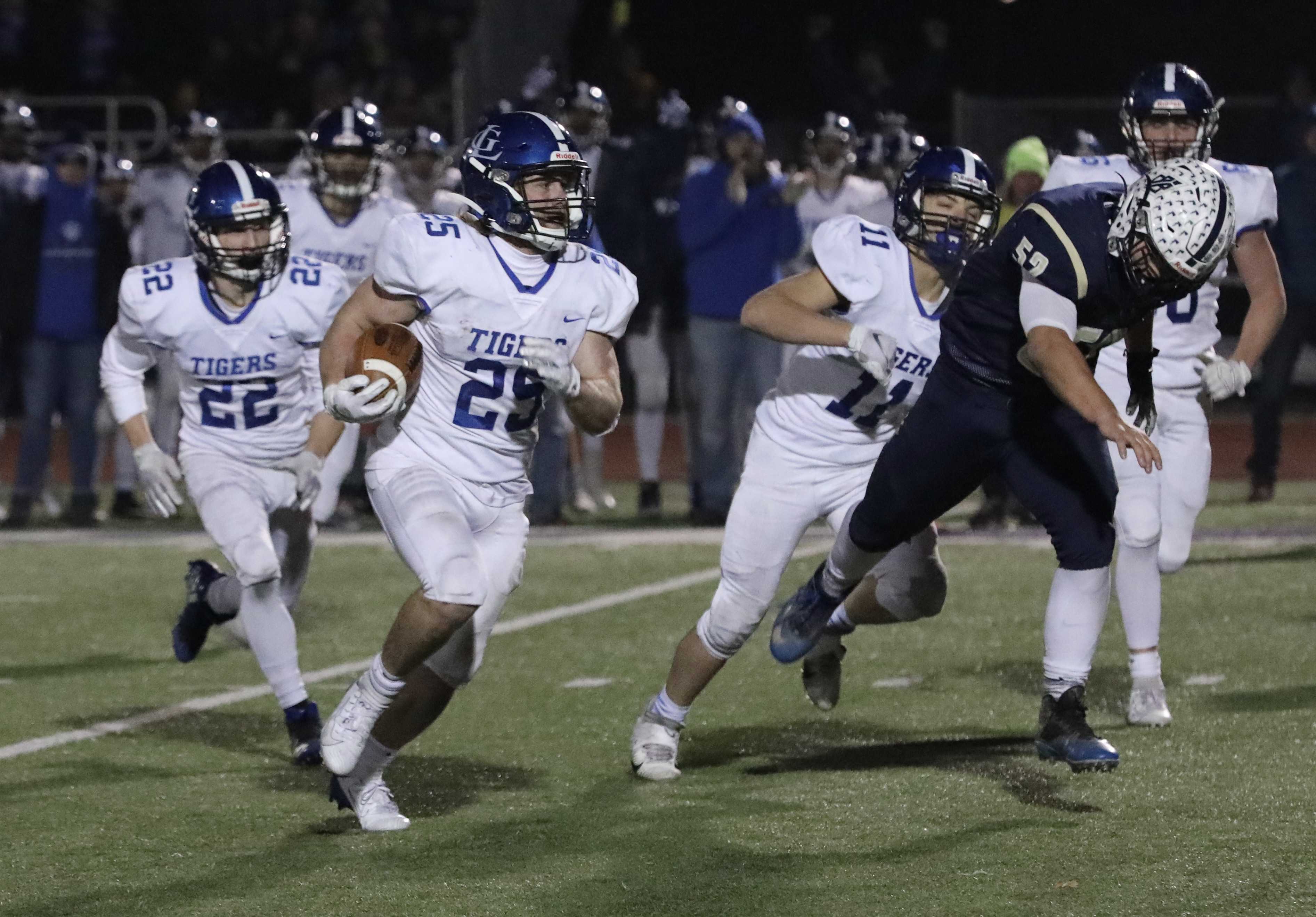 La Grande's Nathan Reed sprints past Banks defenders for a touchdown after a third-quarter interception. (Norm Maves Jr.)