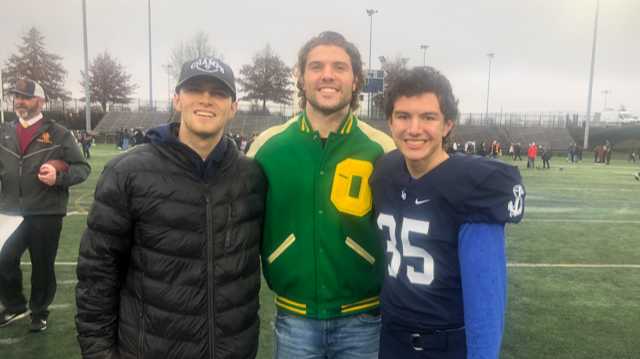 Brady Breeze is flanked by brothers Bryson, left, and Brock