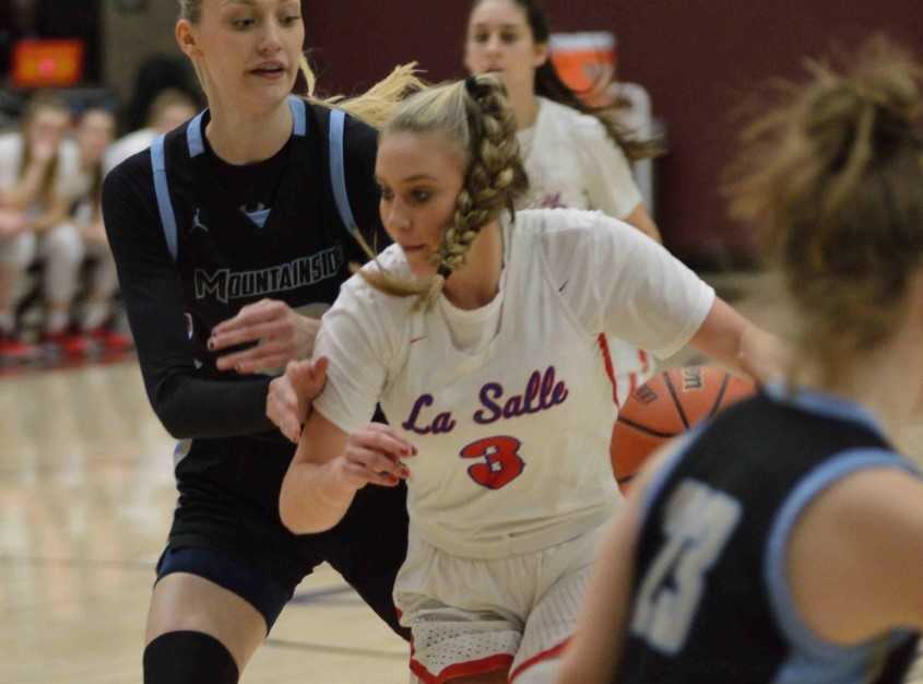 La Salle Prep junior Addi Wedin drives past Mountainside senior Cameron Brink. (Photo by Derrick Drango)