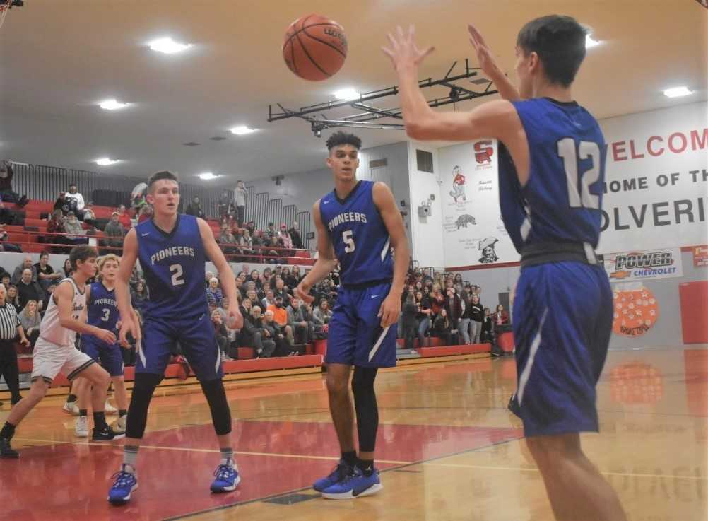 Western Christian's Alexander Nicoli (2), Payton Richardson (5) and Jordan Trammell (12) go after a rebound Friday.