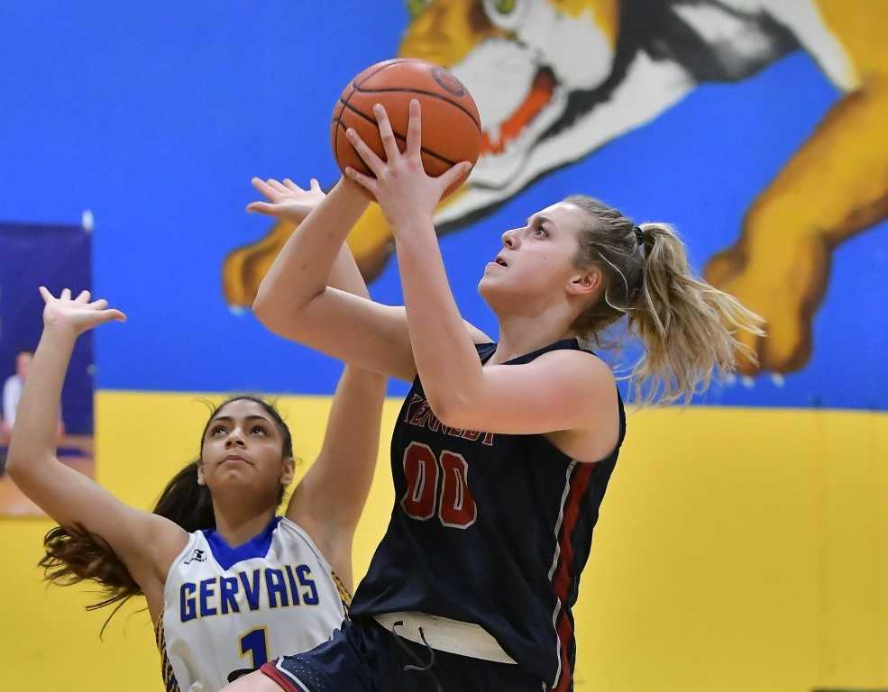 Kennedy's Sophia Carley shoots over Gervais' Celi Vasquez on Friday night. (Photo by Andre Panse)