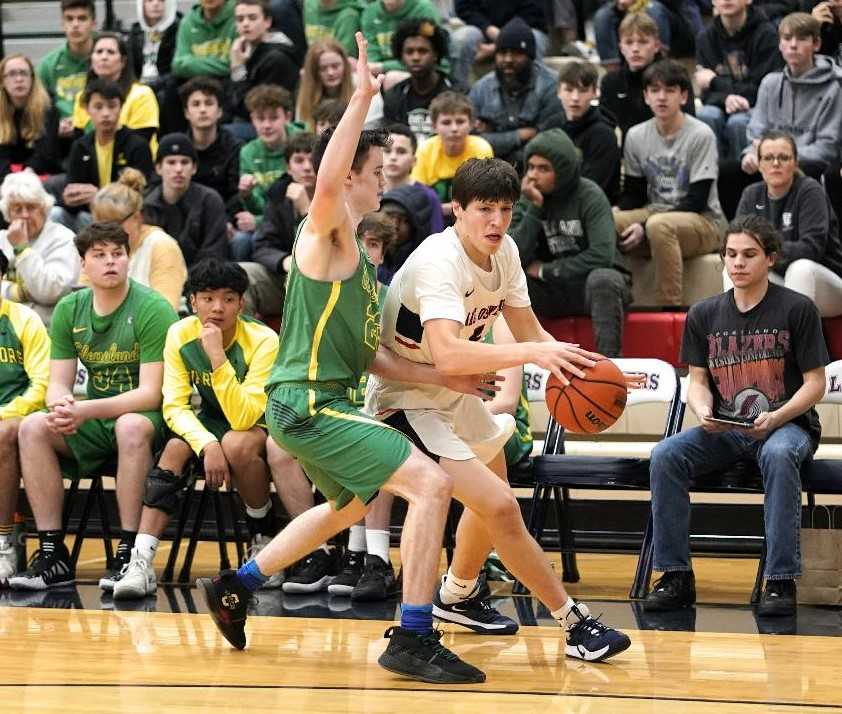 Casey Graver (right) and Lake Oswego eliminated Cleveland 44-28 on Wednesday night. (Photo by Jon Olson)