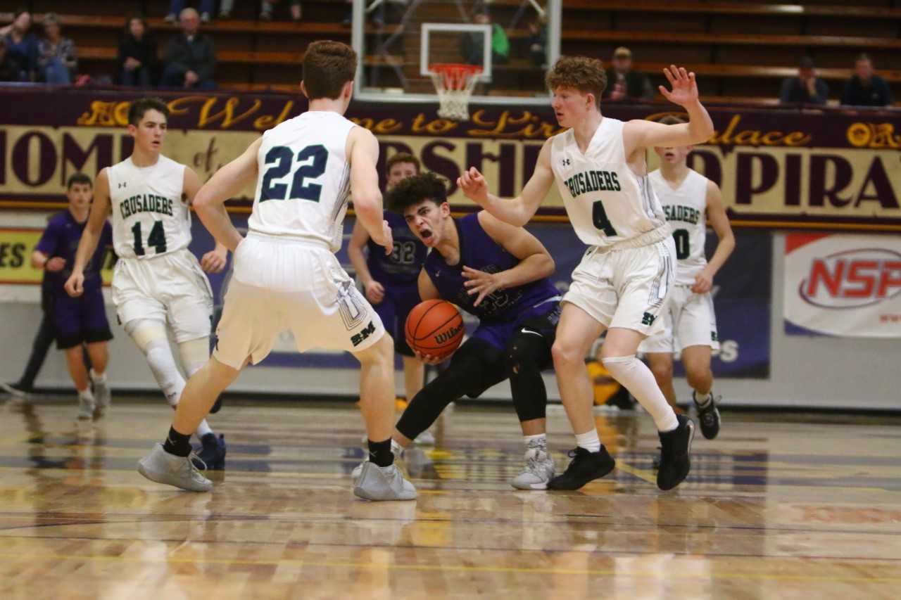 Cascade Christian's Donminic Lewis (center) scored 22 points against St. Mary's. (NW Sports Photography)