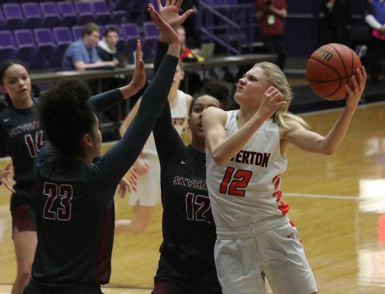 Beaverton's Mary Kay Naro shoots over Southridge's Maya Hoff (12) and Tait Quinlan. (Photo by Norm Maves Jr.)