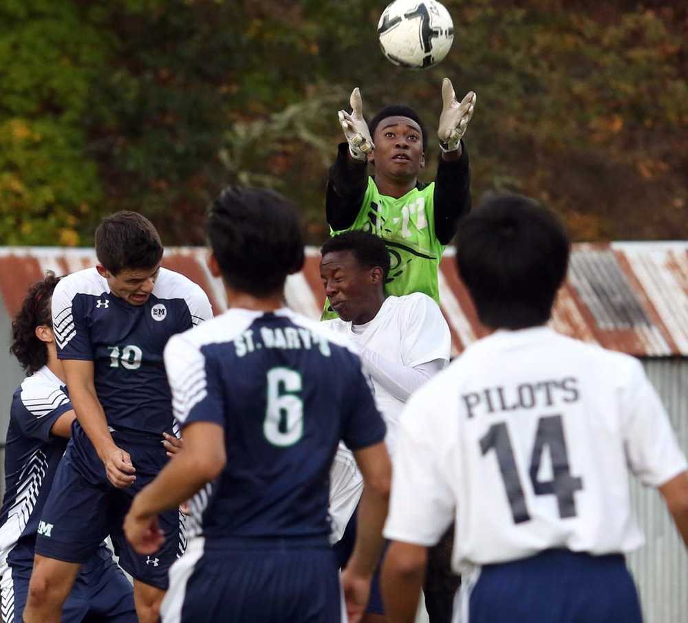 Lester (in green) hopes to play soccer or basketball at Lane CC next year. Photo courtesy of Michael Sullivan, News Review