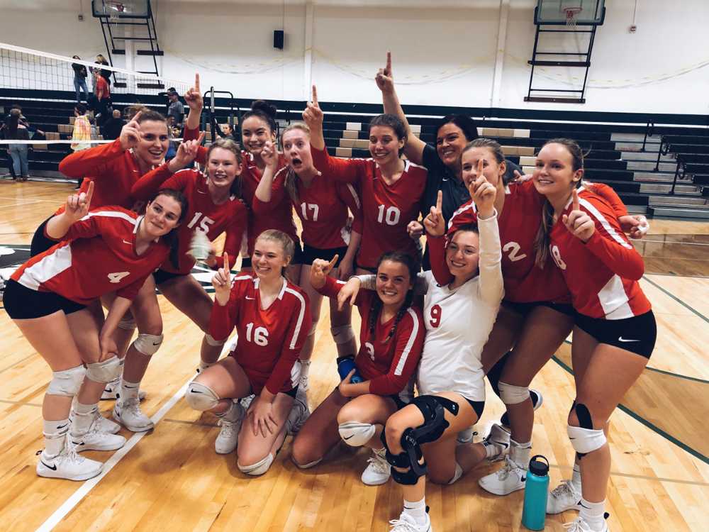 Angela Davis (in black) celebrates a conference title with her Cardinal team