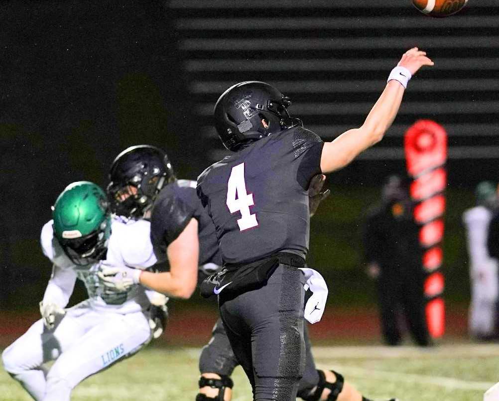 Tualatin's Jackson Jones, who threw three touchdown passes in the opener, is in his third varsity season. (Photo by Jon Olson)