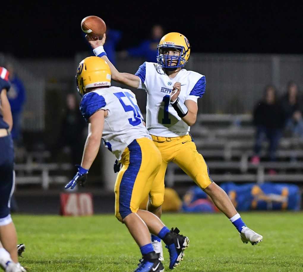 Landon Mitchell threw for 225 yards and four touchdowns in Heppner's win over Kennedy on Friday. (Photo by Andre Panse)