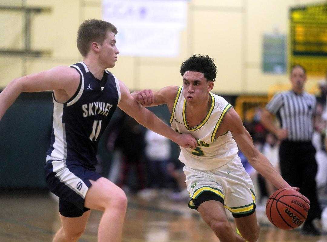 West Linn's Jackson Shelstad drives against Skyview's Giles Sullivan in Friday's season-opening win. (Photo by Jon Olson)