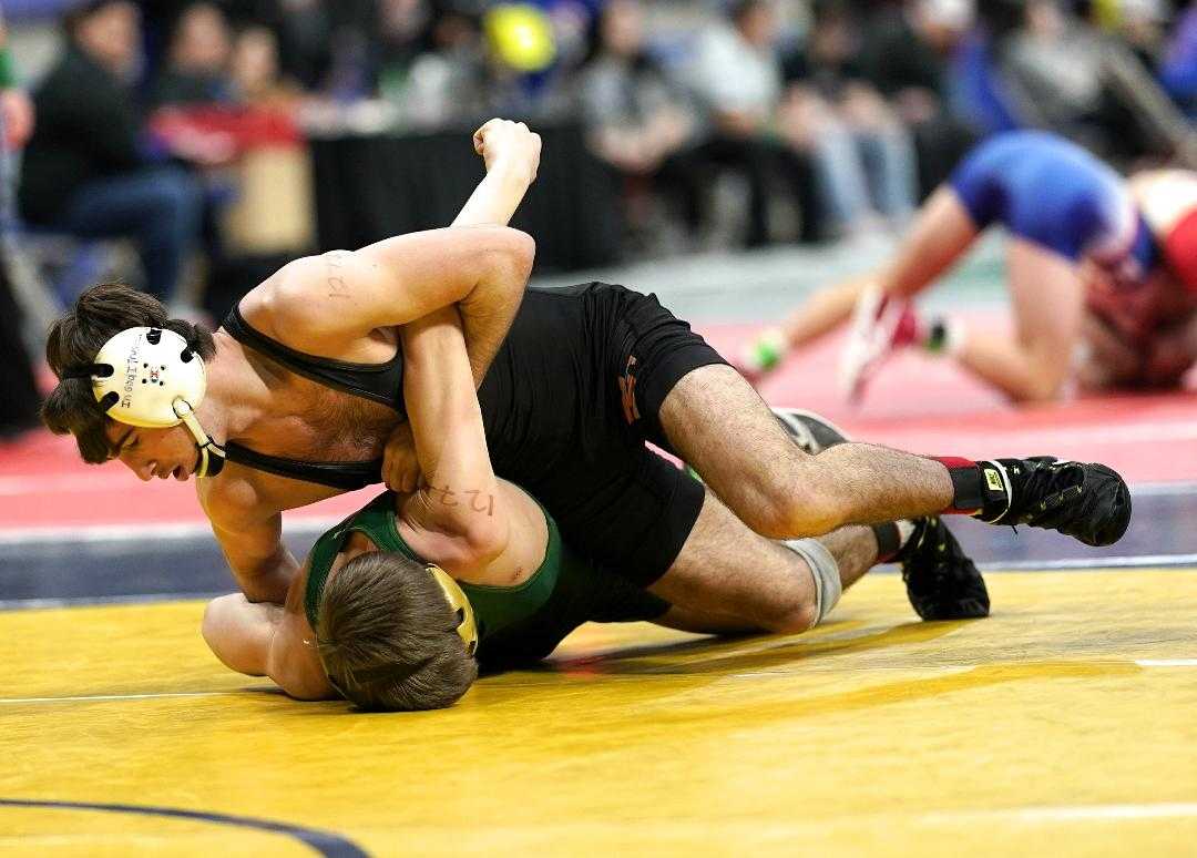 Silverton's Kaden Kuenzi (top) battles with Pendleton's Collin Primus in the 5A tournament in 2020. (Photo by Jon Olson)