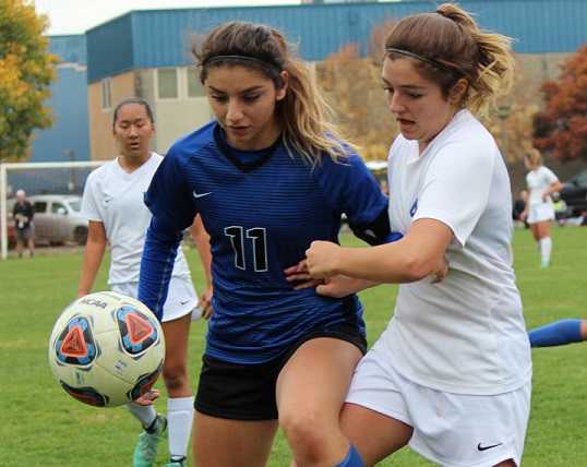 Blanchet Catholic's Brianna Anaya (11) battles with Western Christian's MaKinley Gutierrez. (Photo by Caitlin Elmore)