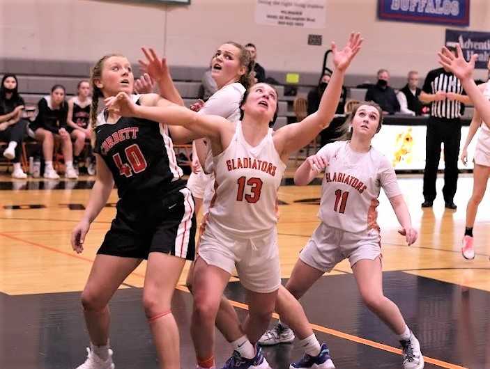 Gladstone's Hanne Hopkins (13) battles for a rebound against Corbett's Sydney Holwege (40). (Photo courtesy Gladstone HS)