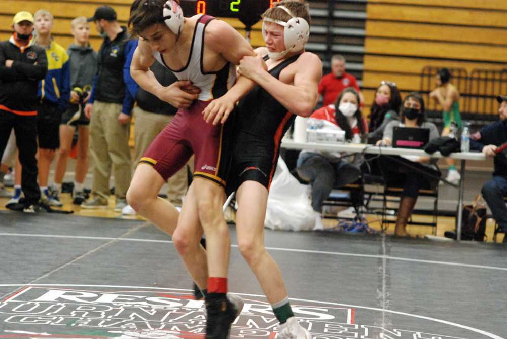 Roseburg's Gage Singleton prepares to throw Everest Sutton of Crescent Valley in the 106-pound division.