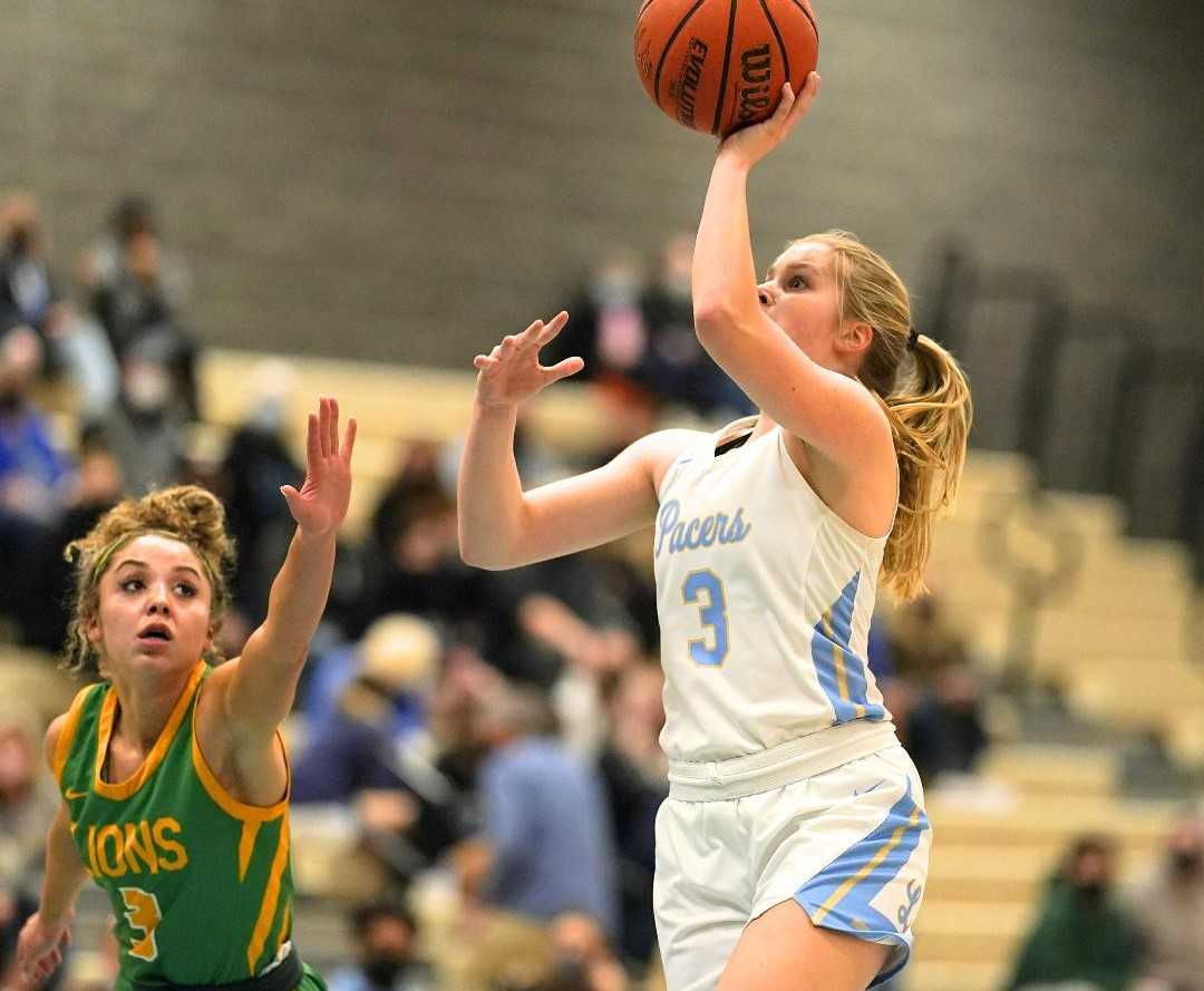 Lakeridge's Reese Ericson shoots over West Linn's Alana Molden in Friday's Three Rivers League game. (Photo by Jon Olson)