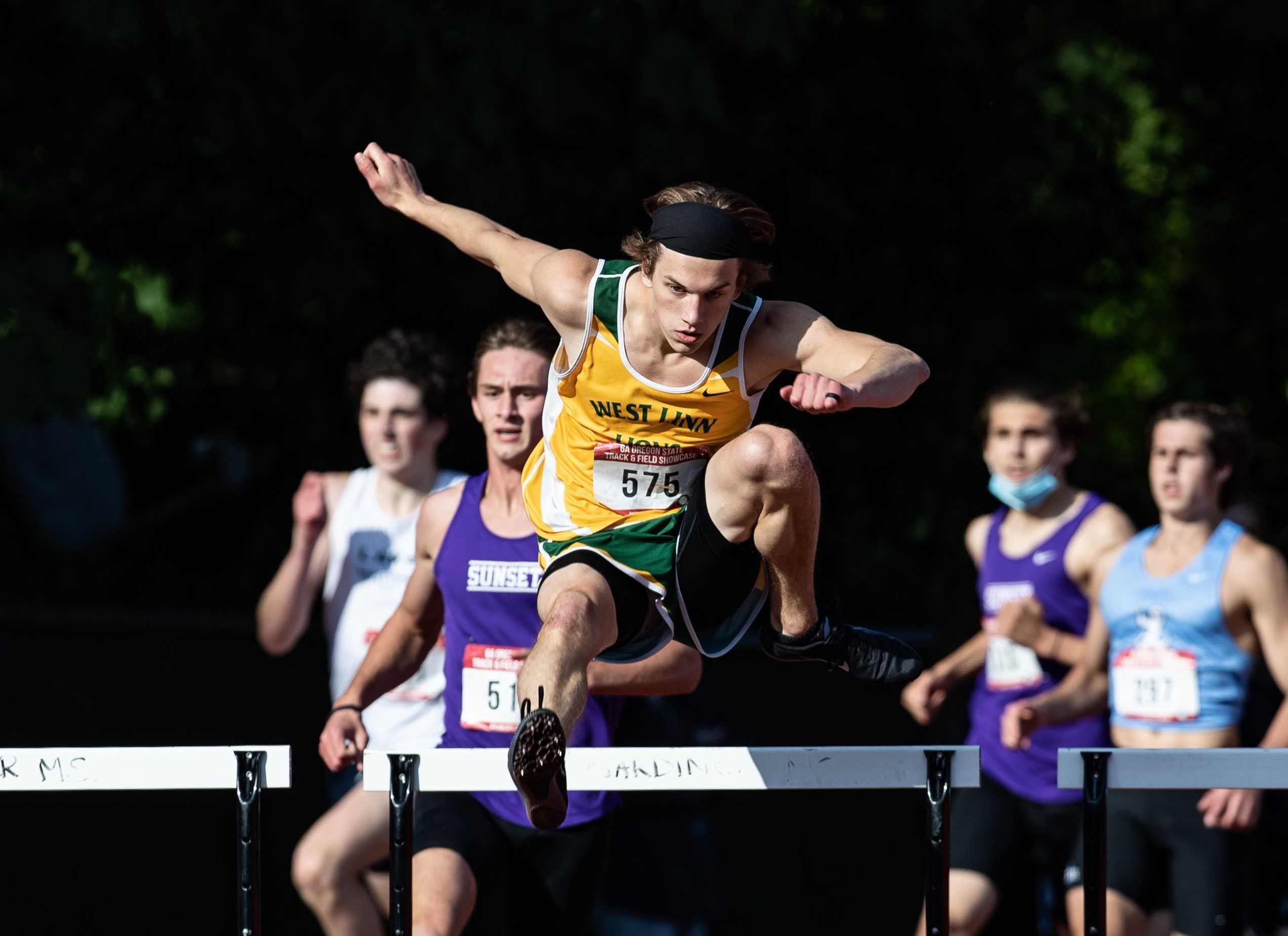 West Linn senior Adam Maxwell won both hurdles races at the Wilsonville Invitational on Saturday. (Photo by Howard Lao)