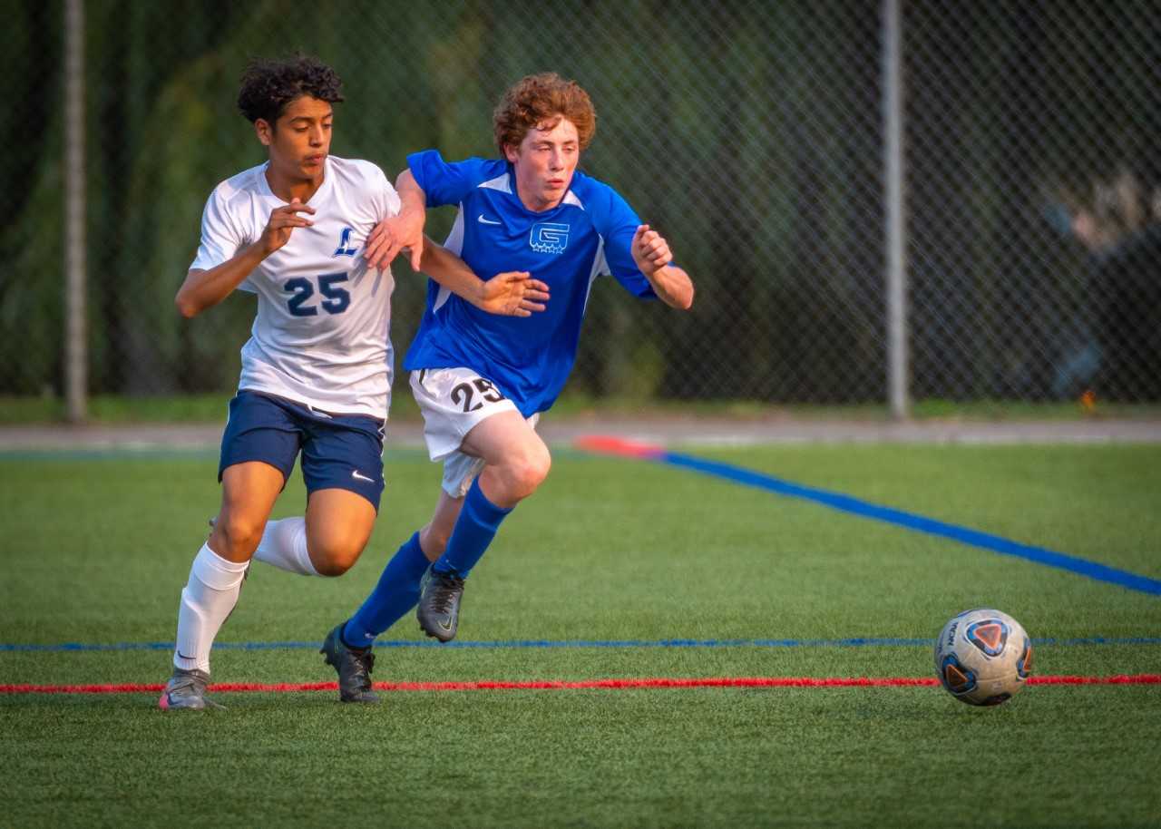 Grant's Miles Ognall (right) battles with Liberty's Niko Martinez in a game last season. (John Davenport/foreyesphotos)