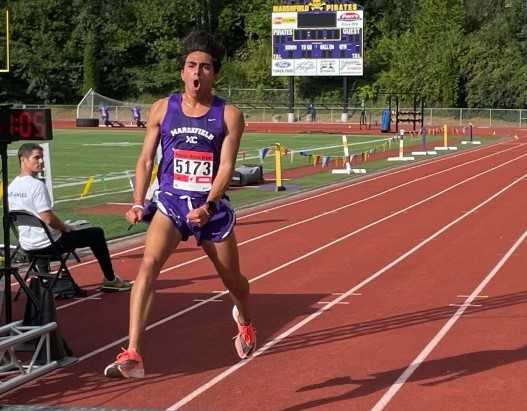 Alexander Garcia-Silver celebrates at the finish of the Prefontaine Memorial Run on Saturday. (Photo courtesy Melinda Silver)