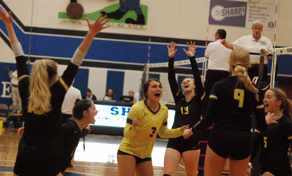 Gracie Peach (3) and Paige McDuff (13) lead the Marshfield celebration after animpressive semifinal sweep