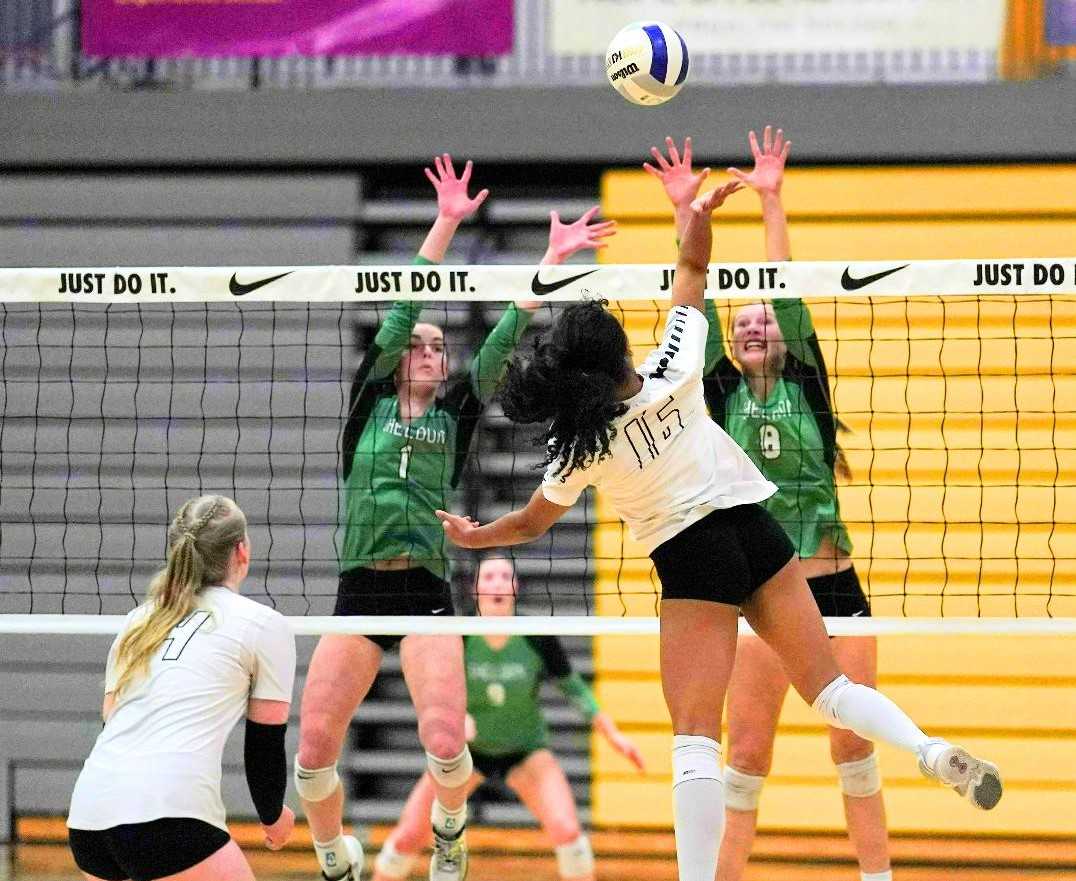 Sheldon's Kait Wood (1) and Gwen Fife (8) block against Jesuit's Jada Johnson in Saturday's 6A final. (Photo by Jon Olson)