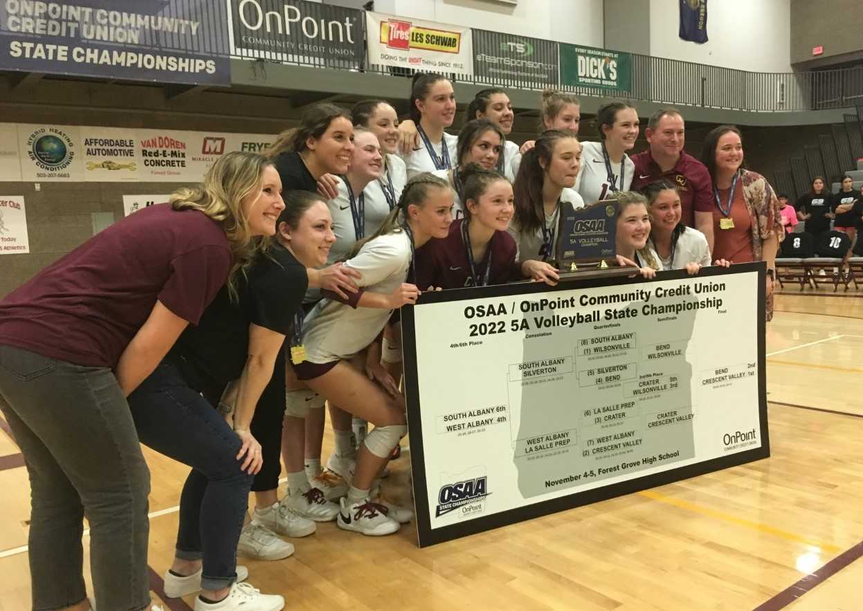 Crescent Valley poses with the 5A championship bracket after defeating Bend in the final Saturday night.