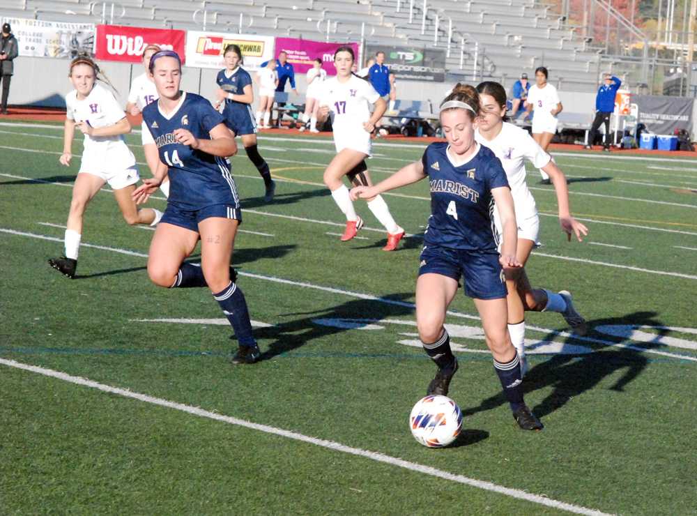 Mattie Andrus (4) and Sela Freeman work towards Hidden Valley's goal. The Spartans seemed one-step ahead all match long.