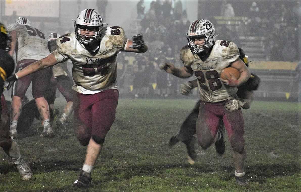 Dayton's Nate Arce follows the blocking of Cannon Capener in Friday's win over South Umpqua. (Photo by Heidi Albright)