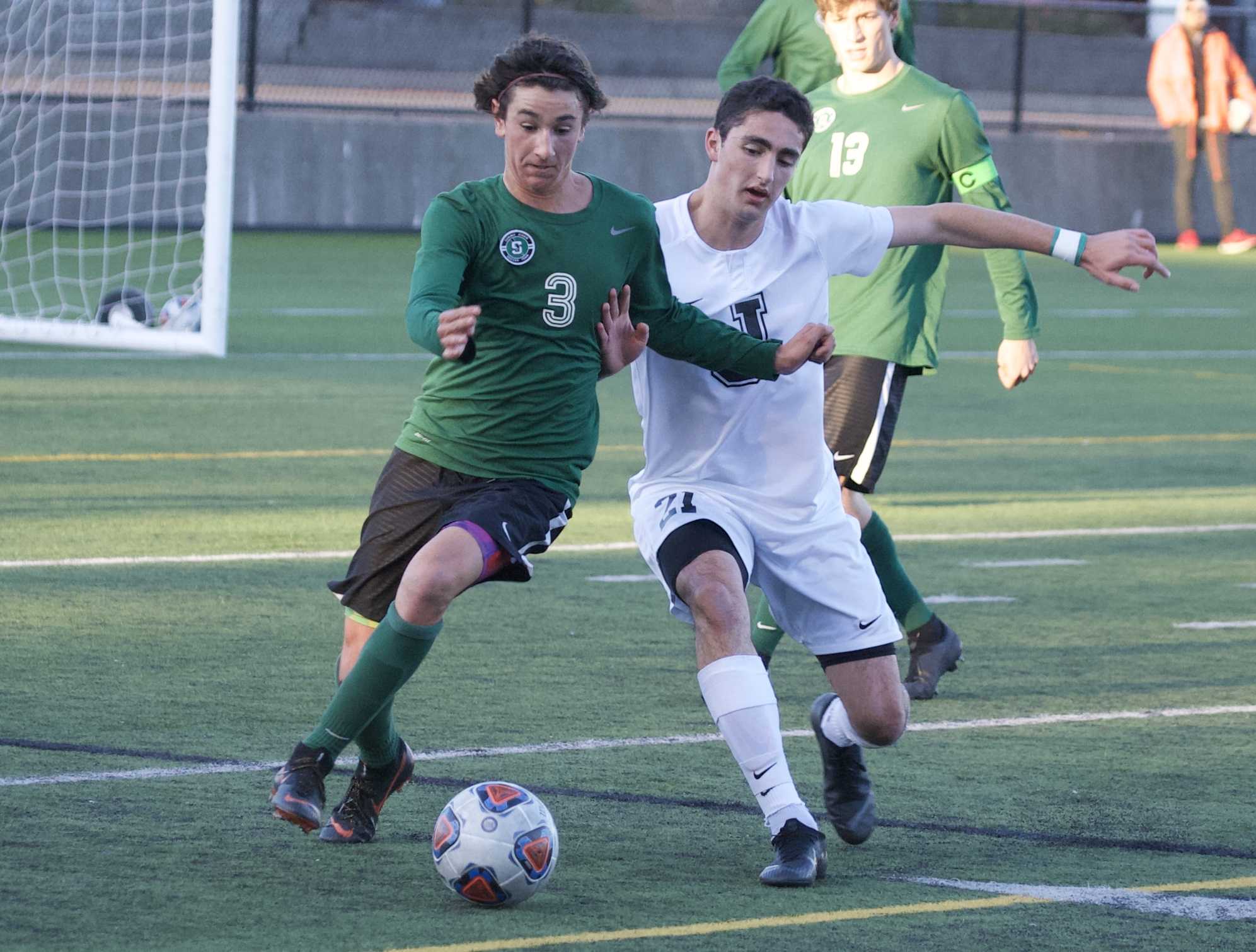 Summit's Jace Marshall (3) and Jesuit's Remington Grayson battle for a ball in the championship game. (Photo by Norm Maves Jr.)