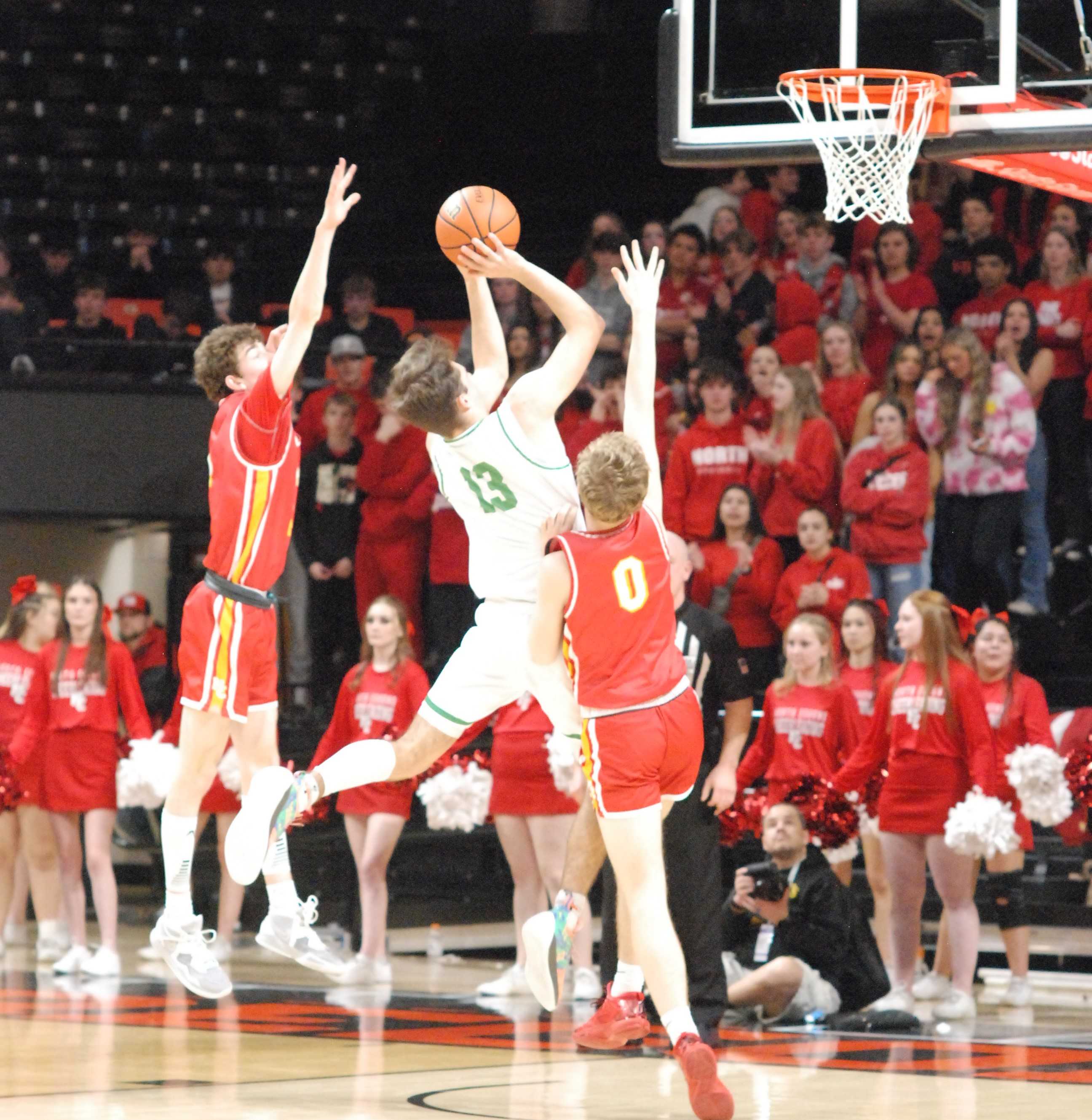 Hogan Carmichael (13) splits North Eugene's defense to score two for top-seeded Summit