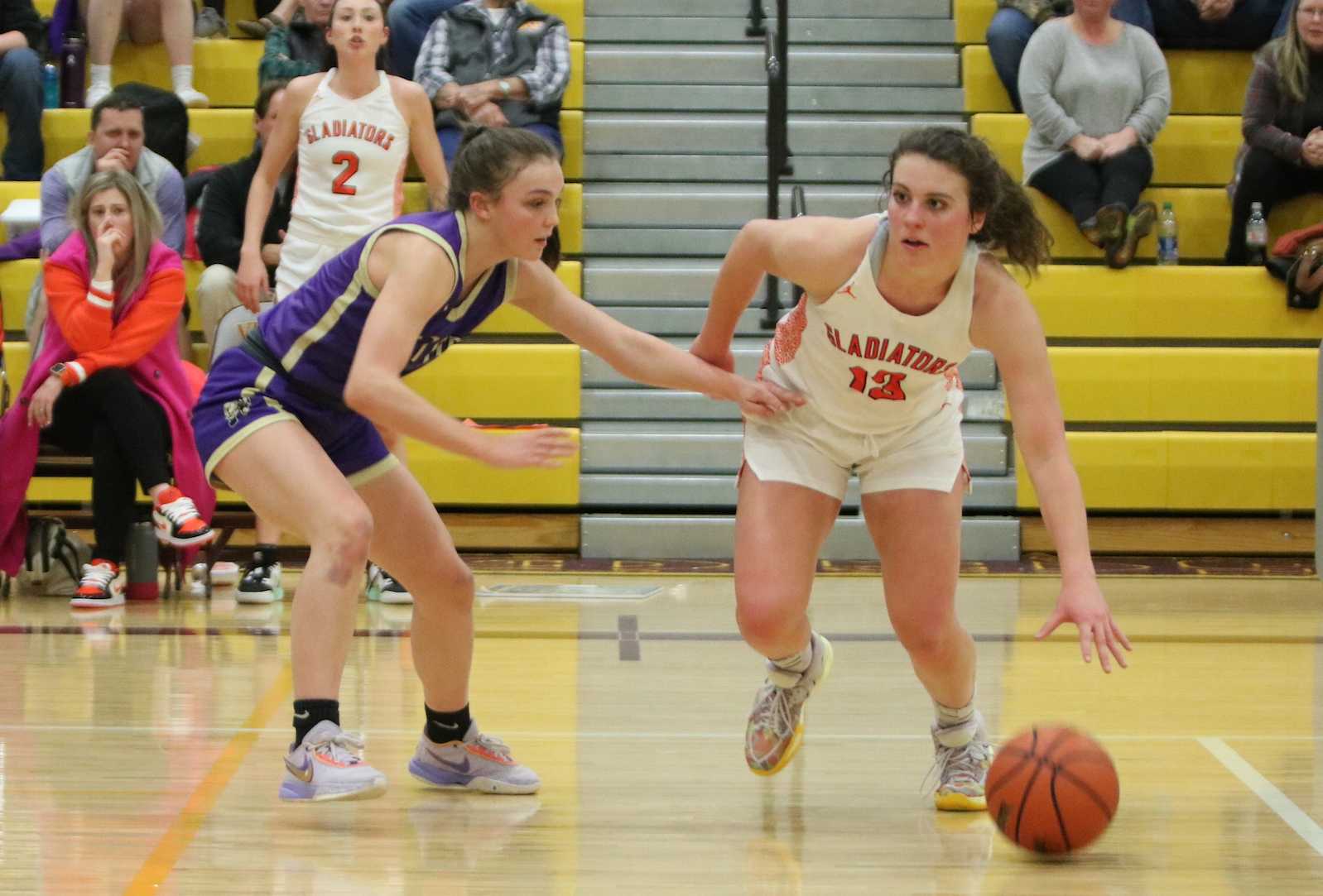 Gladstone's Hanne Hopkins (right) pushed the ball around Astoria's Tayla Huber in Friday's 4A girls semifinal (Jim Beseda)