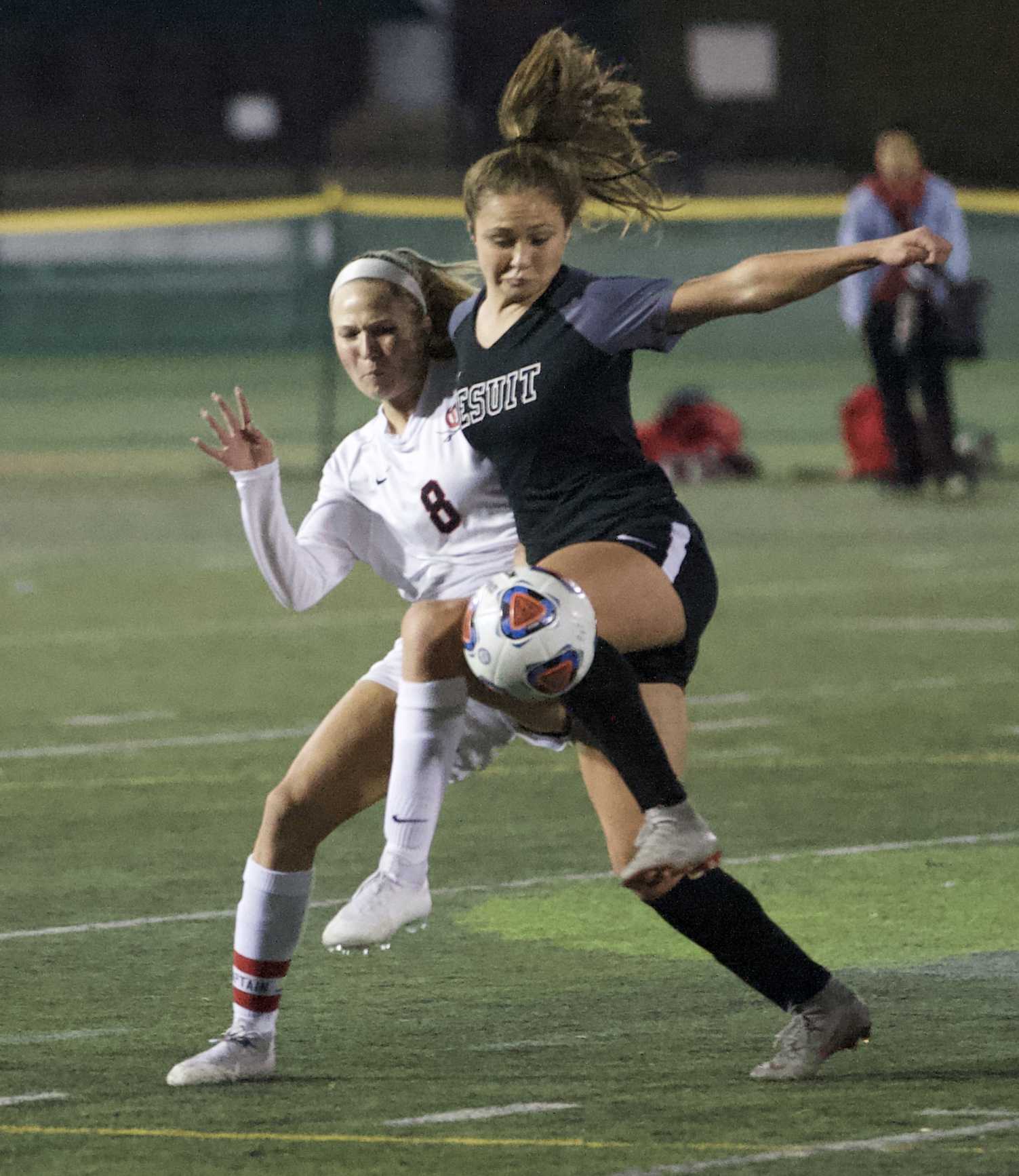 Jesuit's Callan Harrington battles with Clackamas forward Madeline Tetz for a ball at midfield. (Photo by Norm Maves Jr.)