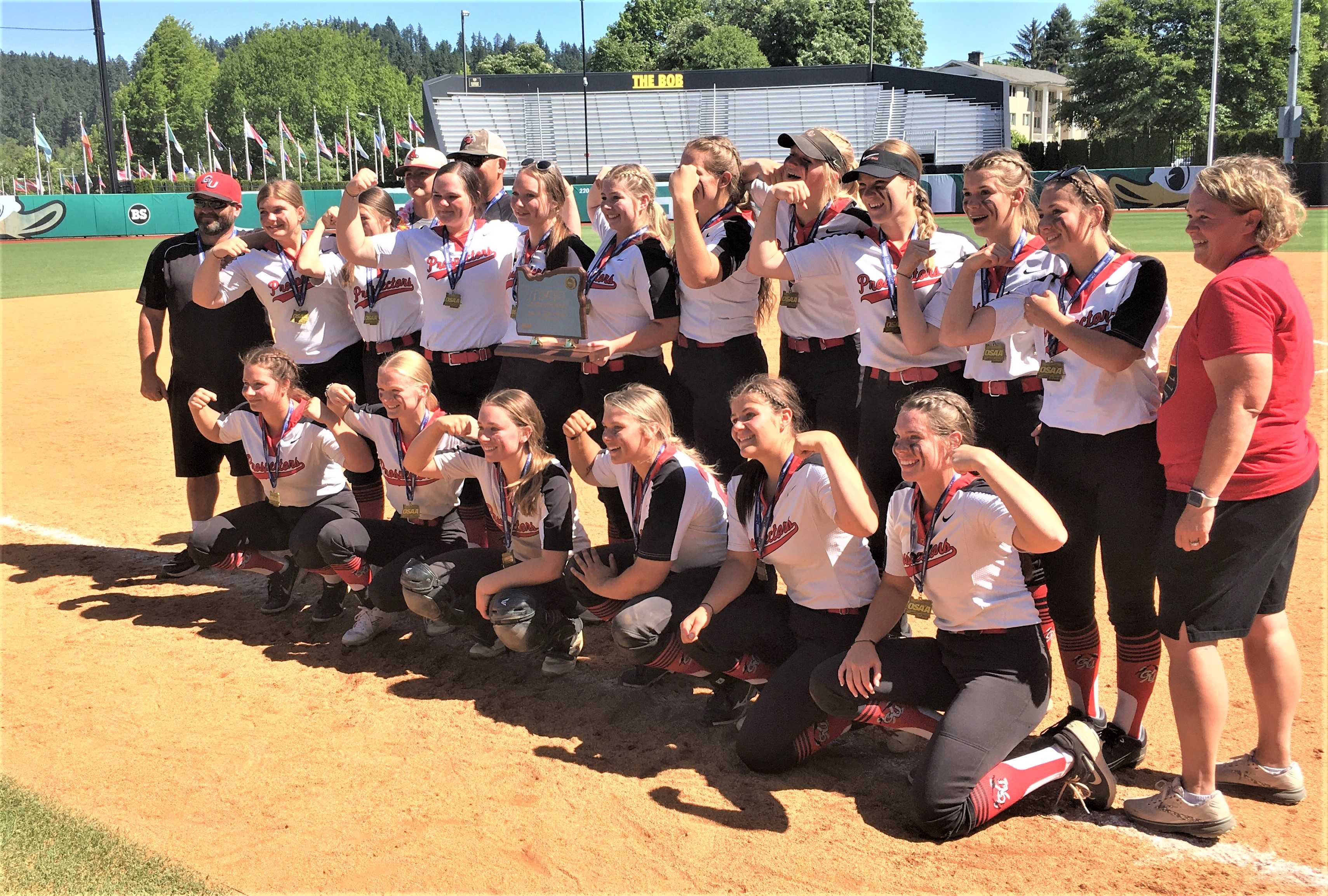 Grant Union/Prairie City poses with its first state championship trophy Friday at the University of Oregon.