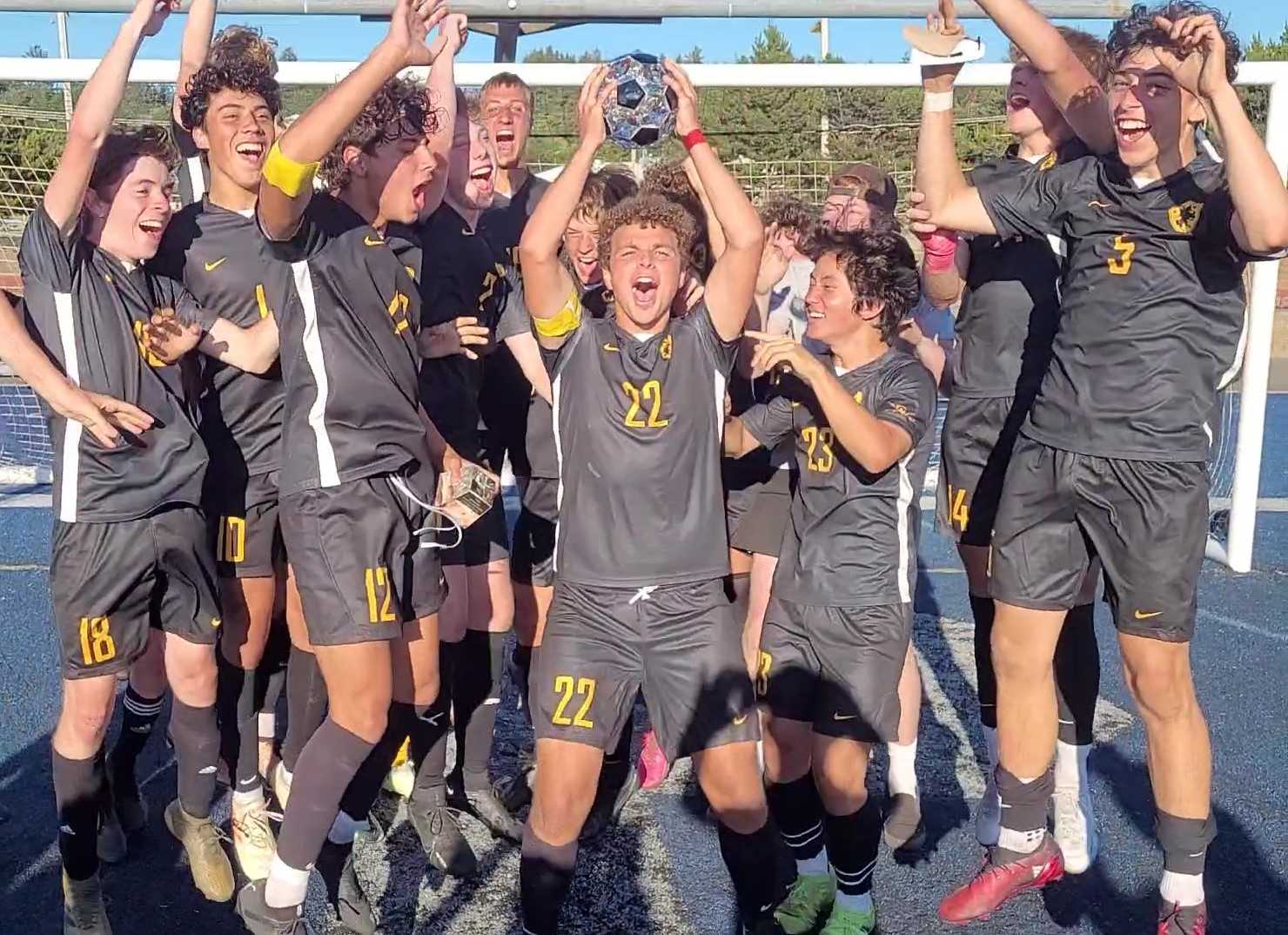 Nicolas Merten (22) and Crescent Valley players celebrate after defeating Canby 1-0 in the final of the Newport Soccer Shootout.