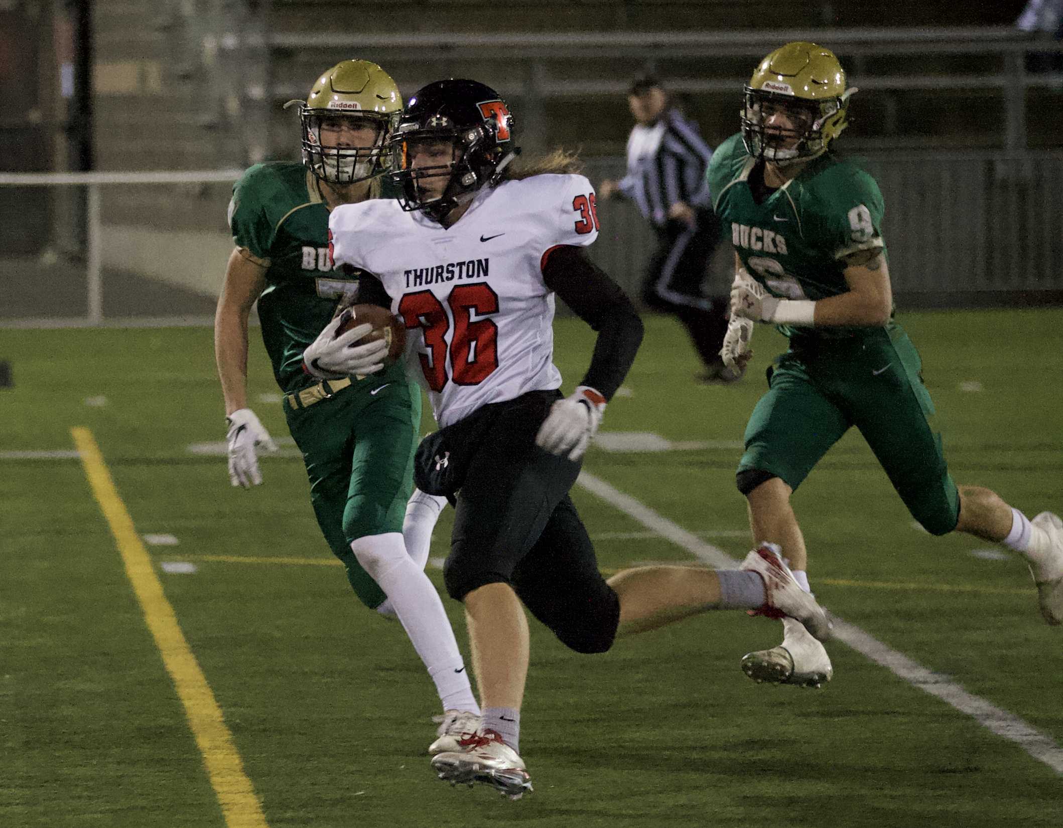 Thurston's Wesley Kommer (36) ran for 150 yards and two touchdowns in the first half Saturday night. (Photo by Norm Maves Jr.)