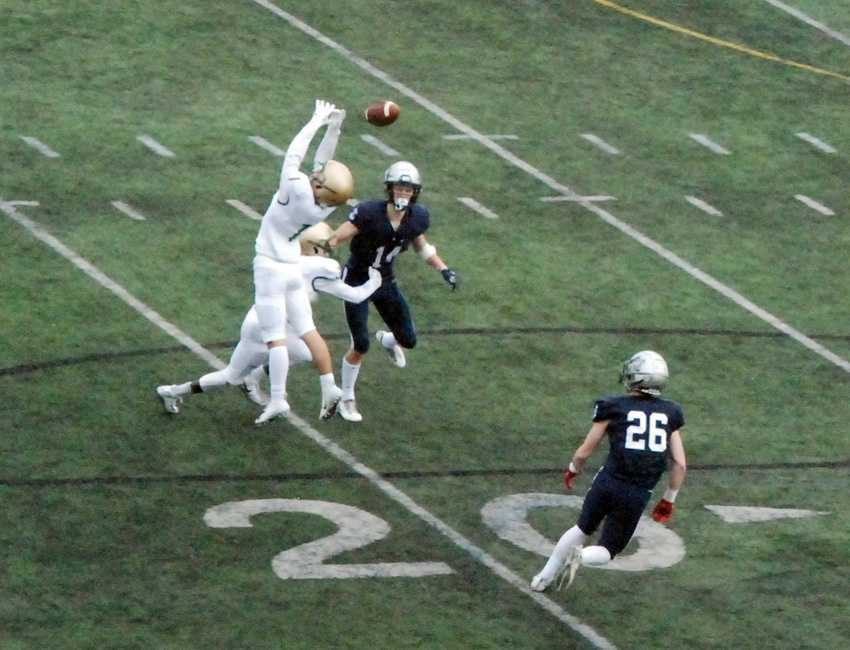 Jesuit corner Campbell Brandt tips this Jackson Laurent pass, which found the waiting arms of Jack O'Brien (26) for an LO score