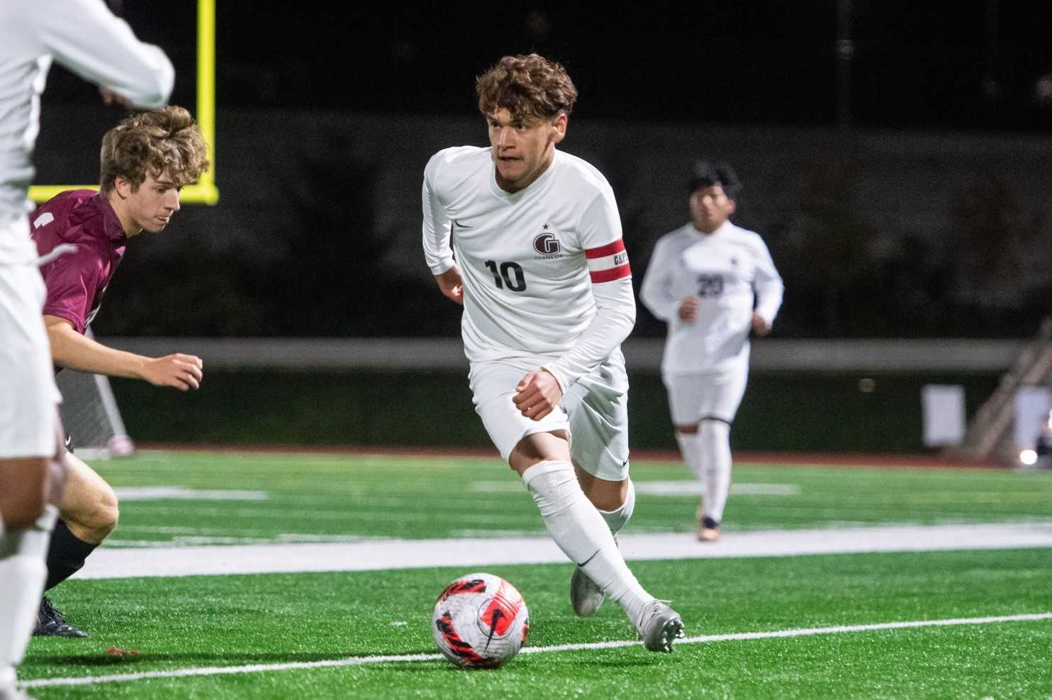 Glencoe senior Christian Martinez Trejo works for possession against Sherwood on Monday night. (Photo by John Lariviere)