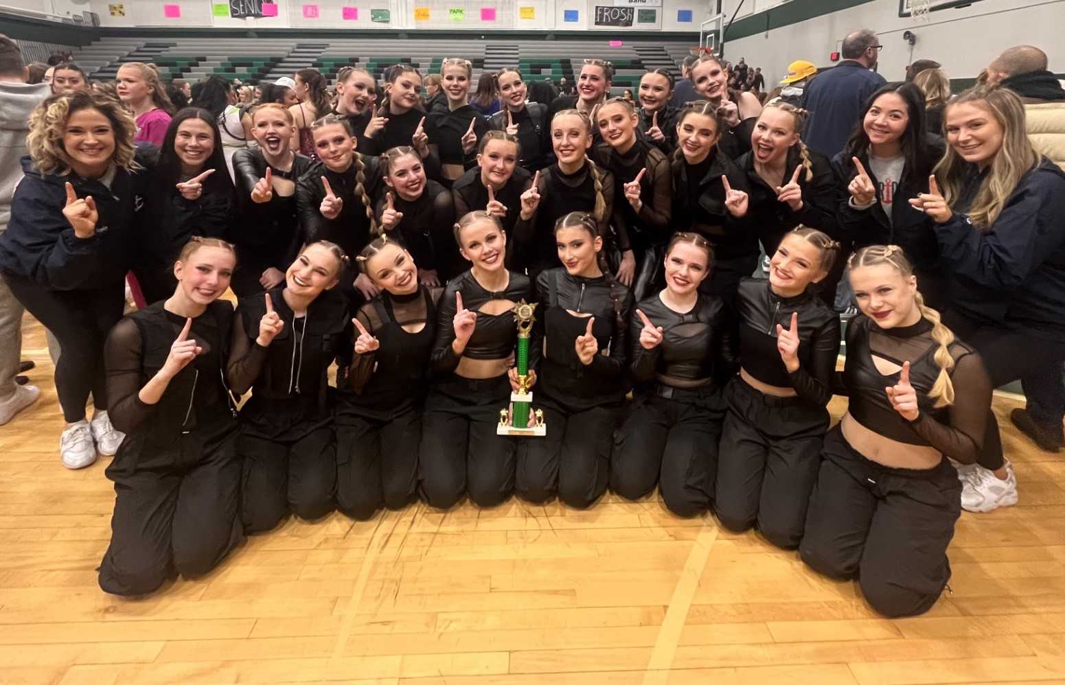 Lake Oswego's dance team poses with its trophy at the Reynolds competition last weekend.