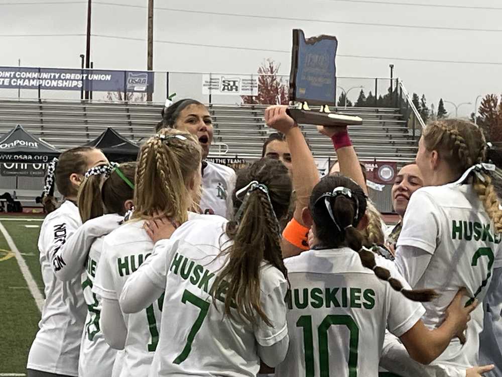 North Marion girls soccer celebrates with the first blue trophy in program history