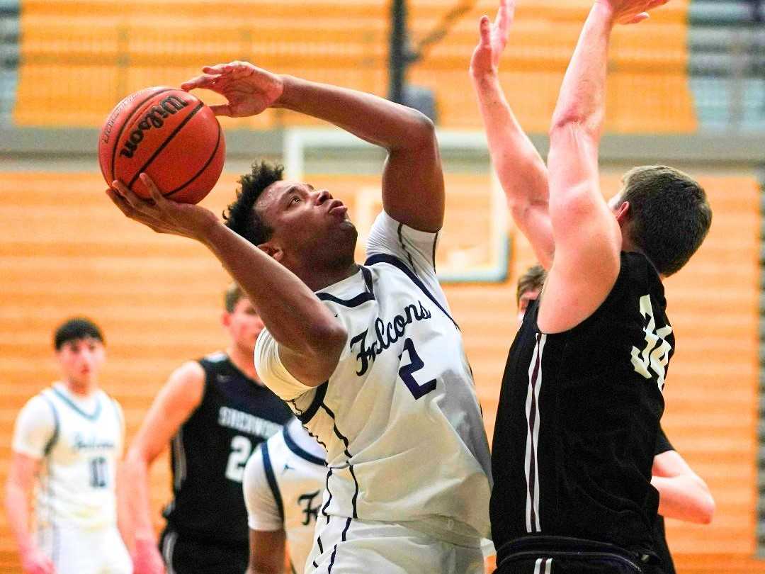 Liberty's Tyler Bradford scored 21 points against Sherwood, including the go-ahead free throw late. (Photo by Jon Olson)