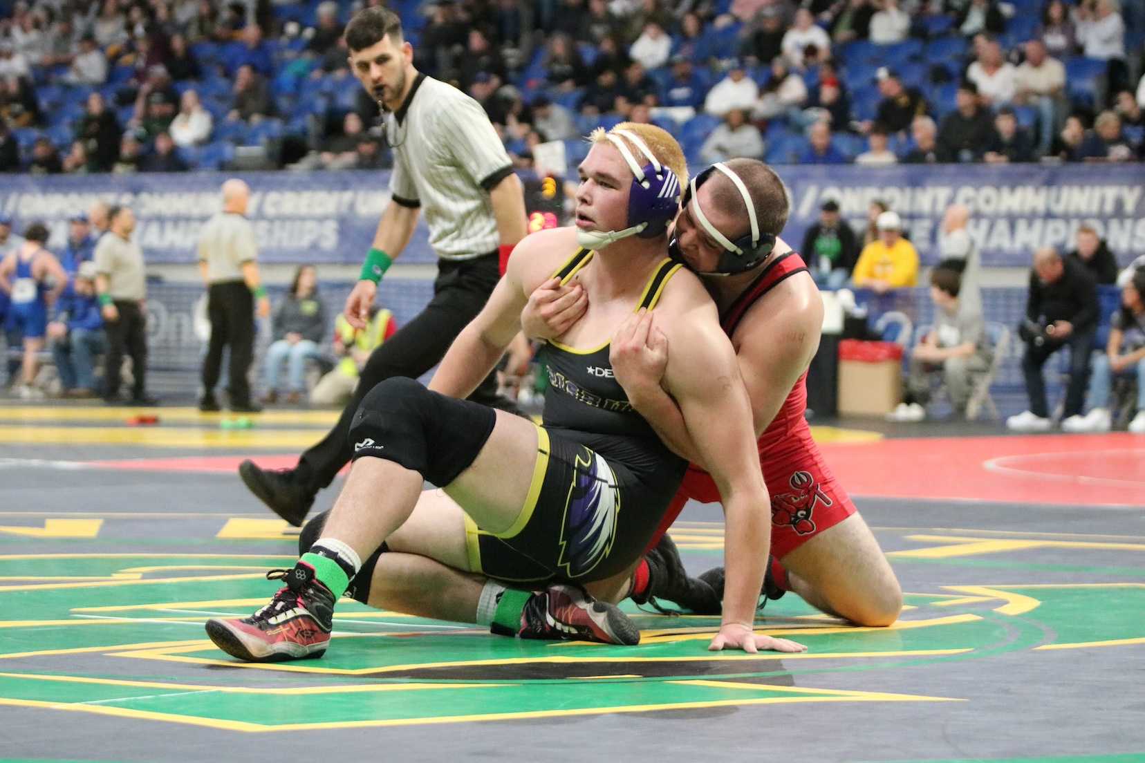 Harrisburg's Cooper Clark (left) won by a 4-3 decision over Coquille/Bandon's Tommy Vigue on Thursday. (Jim Beseda photo)
