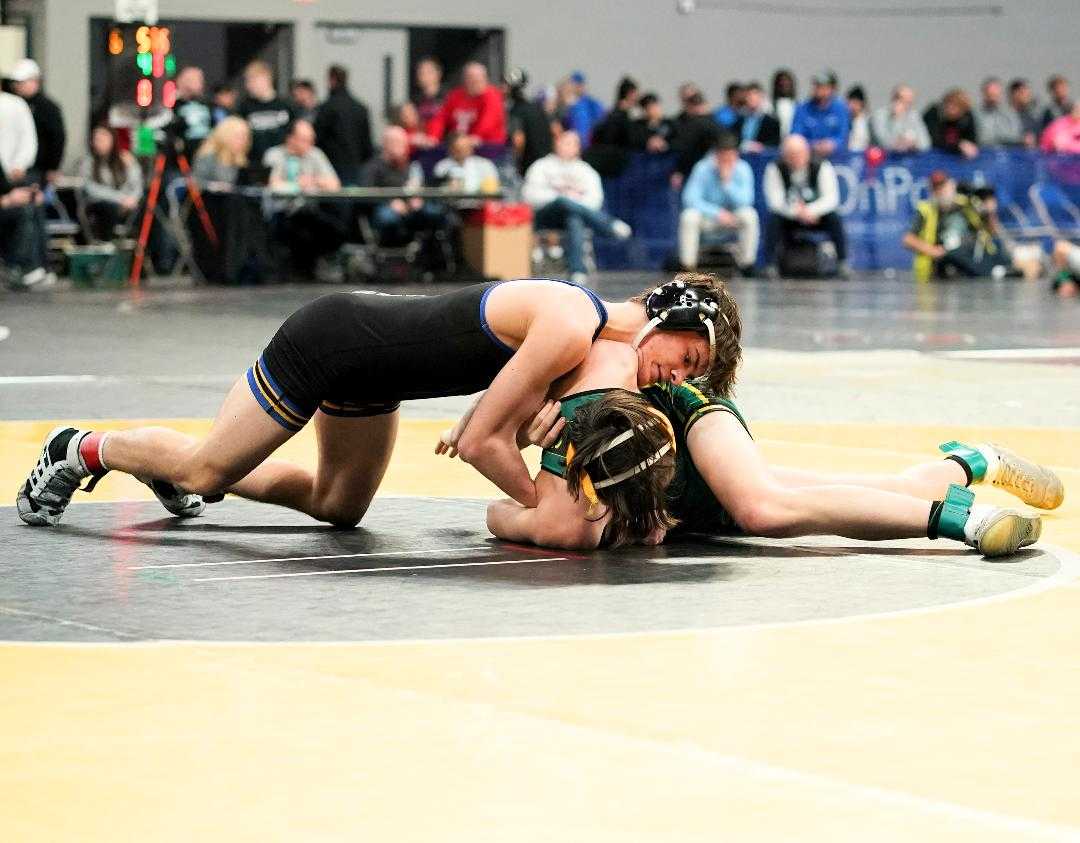 Newberg's Zach Keinonen pinned Cleveland's William Kingman in 45 seconds Friday in the 6A tournament. (Photo by Jon Olson)