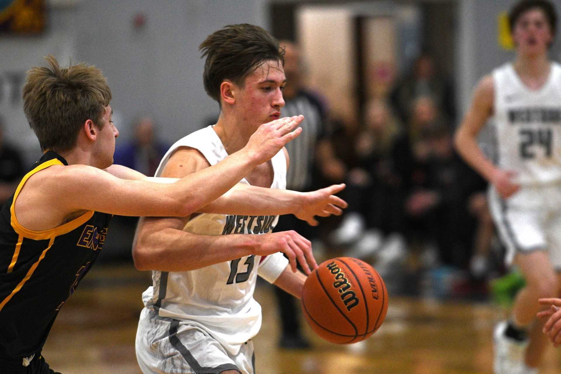 Westside Christian's Dax Hanzlik drives to the hoop against Harrisburg in Friday's semifinal win. (Photo by John Gunther)