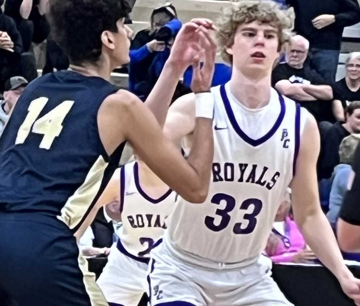 Big men Joshua Louka of Mannahouse Acad. (left) and Colby Getting of Portland Christian prepare to jump it up in an intense semi