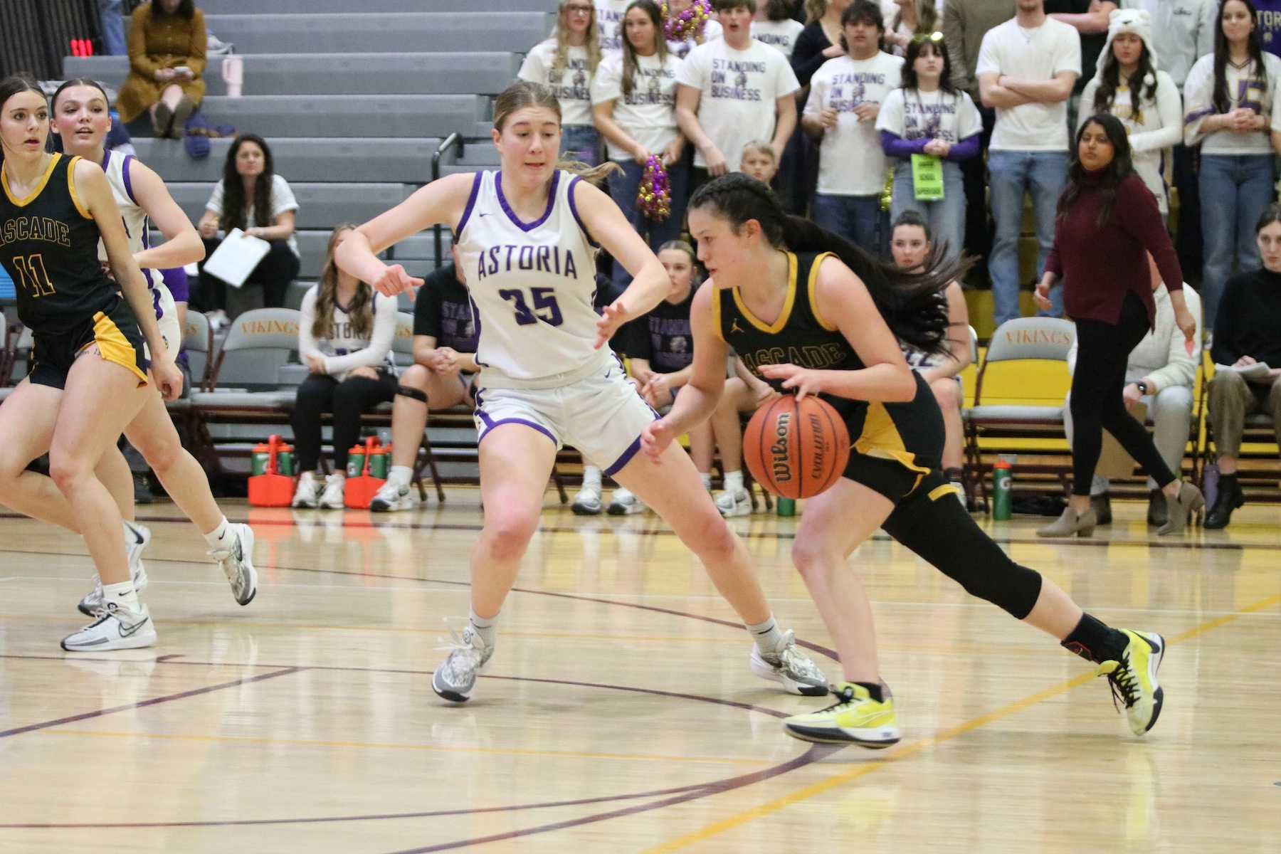 Cascade's Oliviia Bennett drives against Astoria's Malory Dundas during the first half of Friday's semifinal. (Jim Beseda photo)