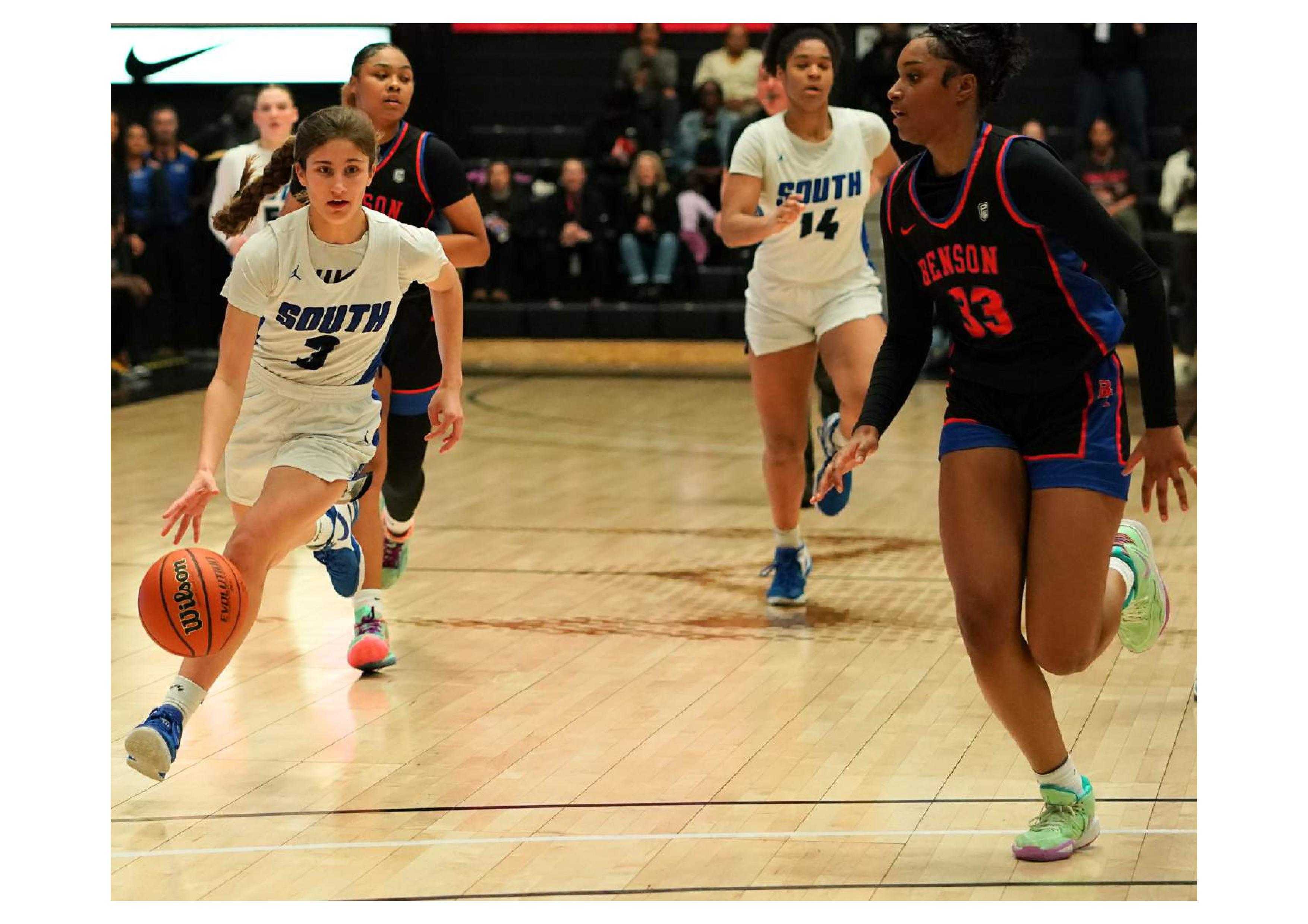 South Medford's Taylor Young (3) races up the floor against Benson's Mahogany Chandler-Roberts. (Photo by Jon Olson)