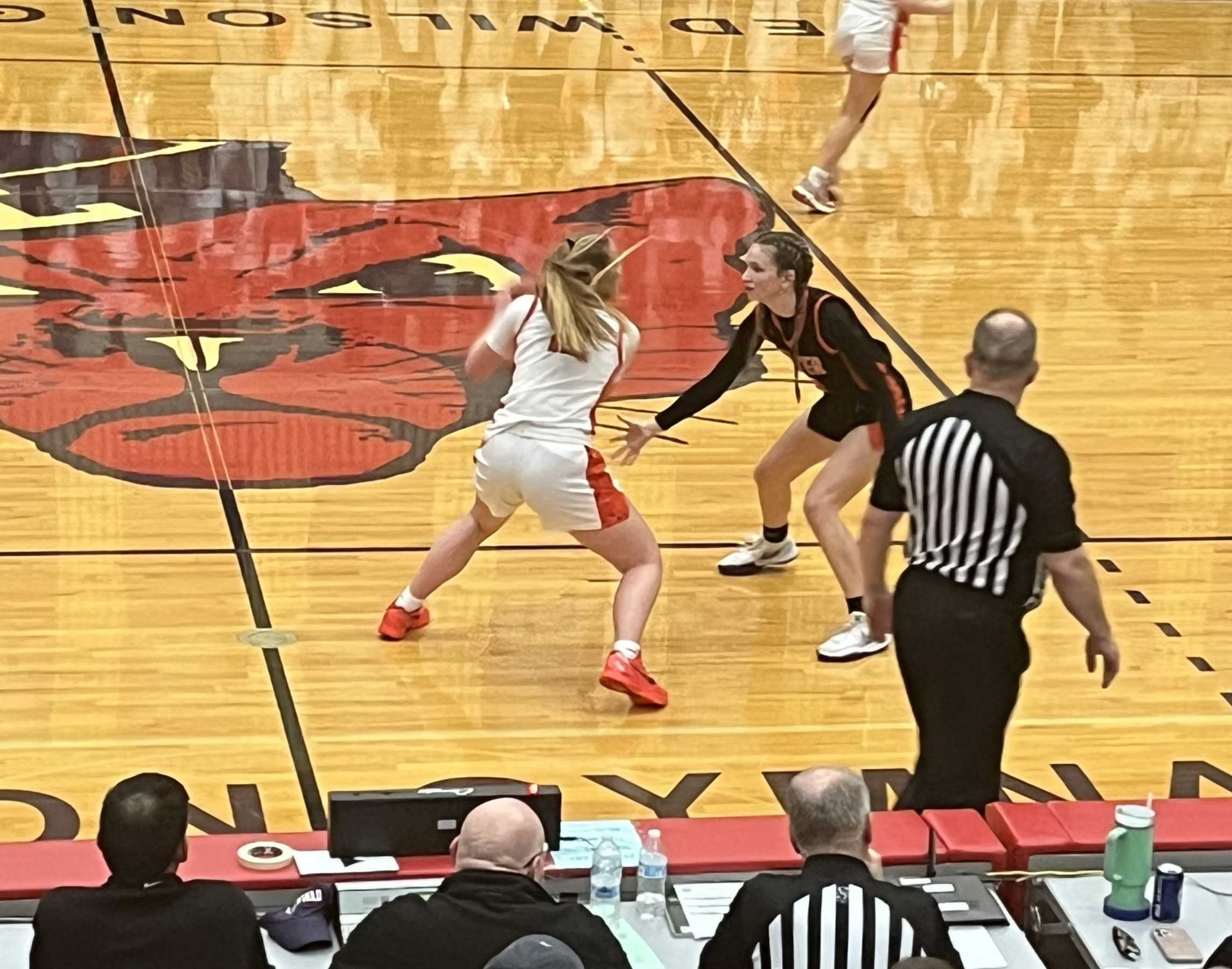 Silverton senior Kyleigh Brown (white) stares down Crater guard Addison Dippel in the closing seconds of regulation