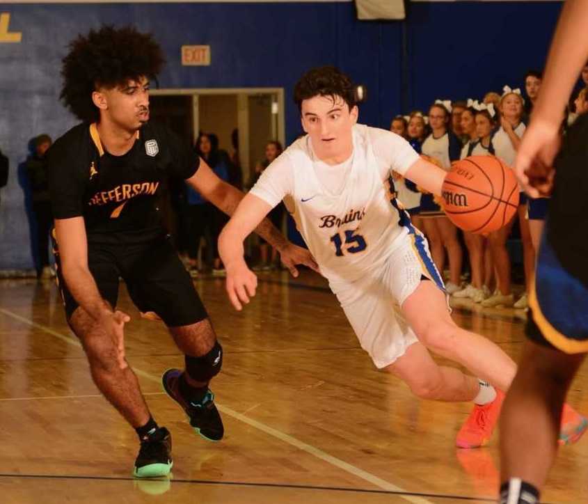 Barlow's Jesse White (15) drives around Jefferson's Marcus Tsohonis. (Photo by Chris Holzbach)